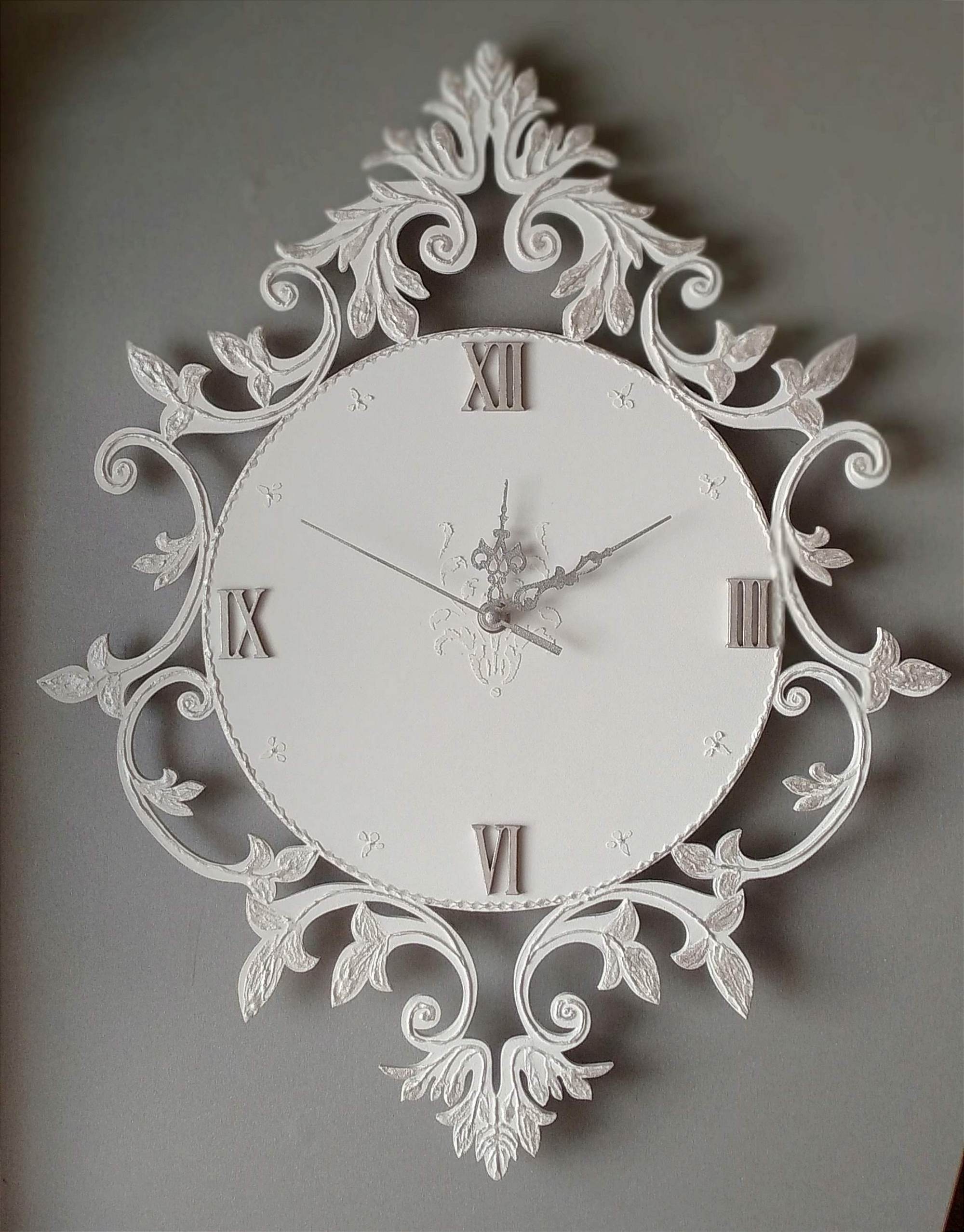 Small white wall clock with silver ornaments in vintage styl Inspire