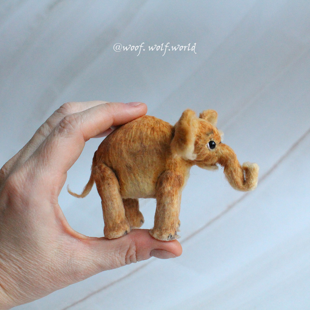 Elephant. Miniature figurine. Realistic crocheted mini toy. Inspire