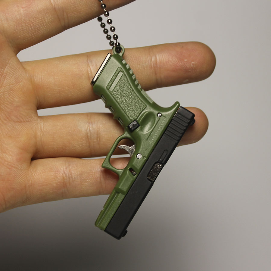 Mini Pistol Keychain Toy with Removable Magazine & Collectible Charm